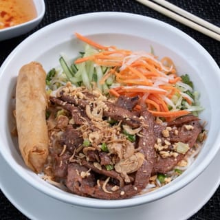 V8. Char-Grilled Marinated Filet Mignon & Crispy Spring Roll over Vermicelli