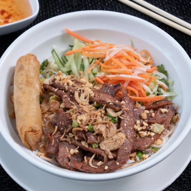 V8. Grilled Marinated Filet Mignon & Crispy Spring Roll over Vermicelli.