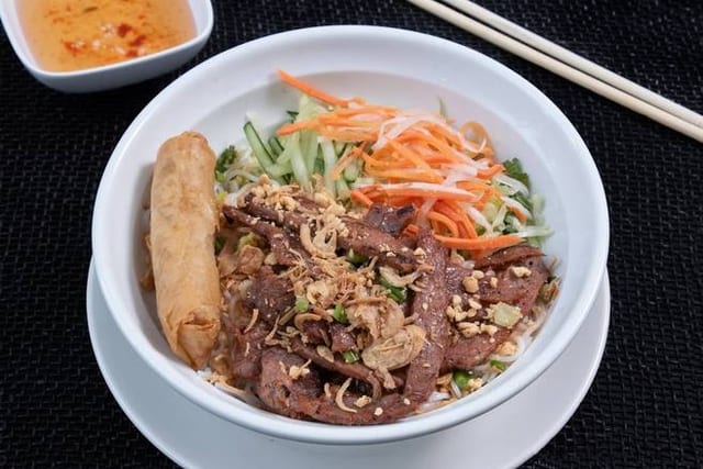 V5. Grilled Marinated Chicken & Crispy Spring Roll over Vermicelli.